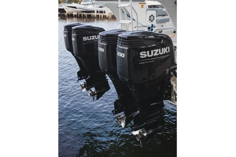  Yacht Photos Pics Triple Suzuki outboard motors on 2024 YachtCat 41, docked in marina.