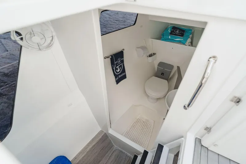  Yacht Photos Pics 2024 YachtCat 41 interior bathroom with modern amenities and nautical decor.
