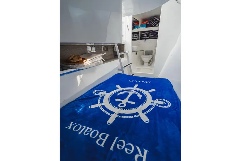  Yacht Photos Pics Luxurious 2024 YachtCat 41 interior with cozy cabin and modern bathroom.