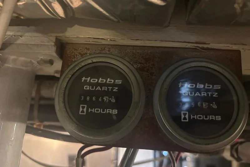 Wonderer Yacht Photos Pics Hobbs hour meters on a 1987 Bertram 54 Convertible boat, displaying engine hours.