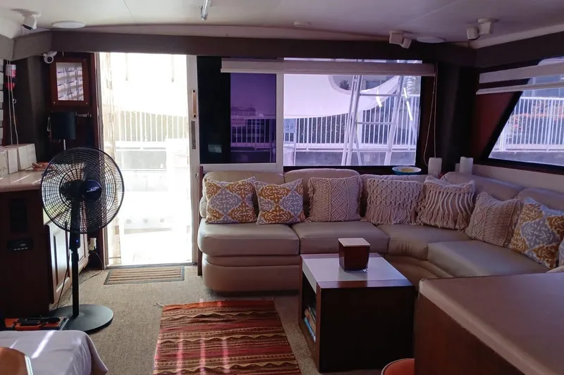 Paloma Yacht Photos Pics Luxurious interior of a 1991 Viking 57 Convertible yacht with cozy seating and decor.