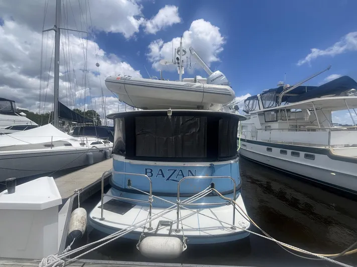 Bazan Yacht Photos Pics 2001 Great Harbour GH47 yacht docked at marina under blue sky.