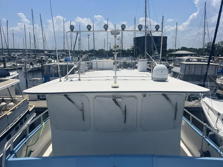 Bazan Yacht Photos Pics 2001 Great Harbour GH47 yacht docked at marina under clear blue sky.