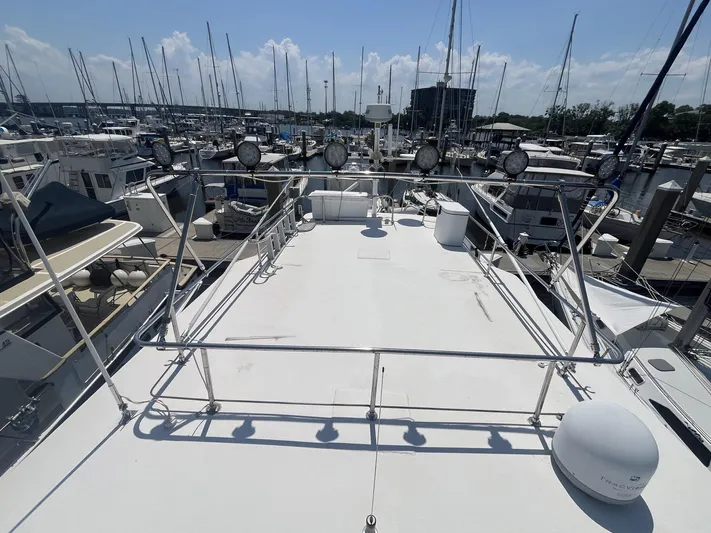 Bazan Yacht Photos Pics Great Harbour GH47 yacht deck, 2001 model, docked at marina with surrounding boats.