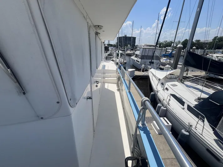 Bazan Yacht Photos Pics Side deck view of 2001 Great Harbour GH47 yacht docked at marina.