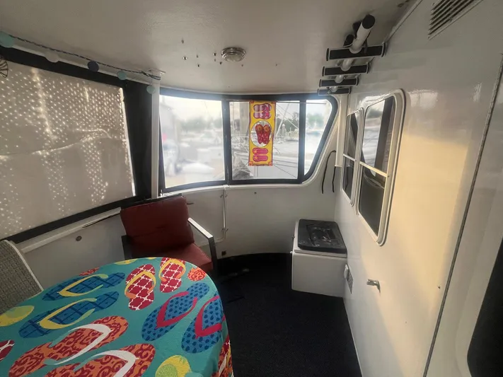 Bazan Yacht Photos Pics Interior of 2001 Great Harbour GH47 boat with colorful tablecloth and seating.