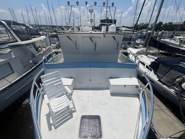 Bazan Yacht Photos Pics Great Harbour GH47 yacht deck, 2001 model, docked among other boats in a marina.