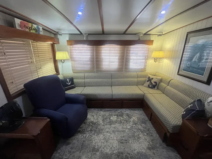 Bazan Yacht Photos Pics Cozy interior of 2001 Great Harbour GH47 with nautical-themed decor and comfortable seating.