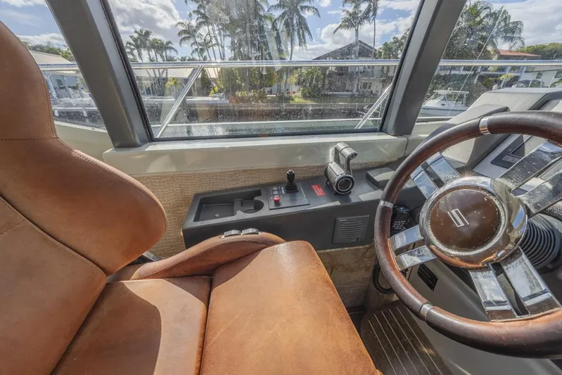  Yacht Photos Pics Interior view of 2009 Azimut 68S yacht cockpit with leather seat and steering wheel.