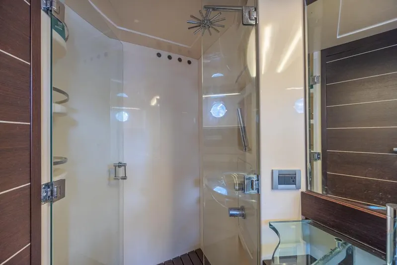  Yacht Photos Pics Luxurious bathroom interior of 2009 Azimut 68S yacht with glass shower enclosure.