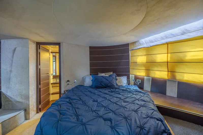  Yacht Photos Pics Luxurious bedroom interior of 2009 Azimut 68S yacht with modern design and cozy bedding.