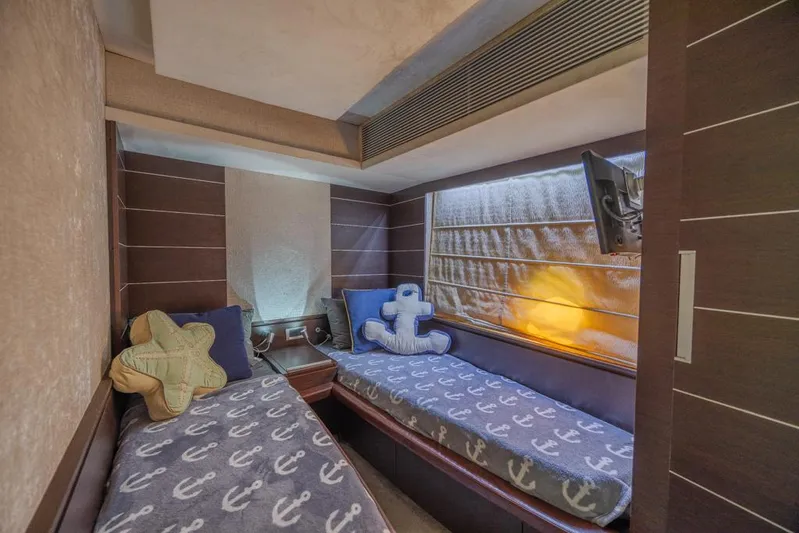  Yacht Photos Pics Cozy twin cabin in 2009 Azimut 68S yacht with nautical-themed decor.