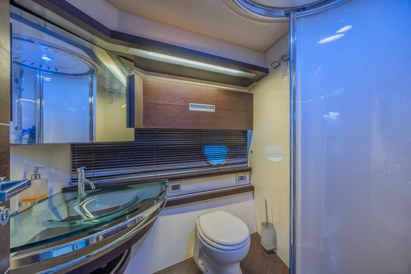  Yacht Photos Pics Luxurious bathroom in 2009 Azimut 68S yacht with modern fixtures and elegant design.