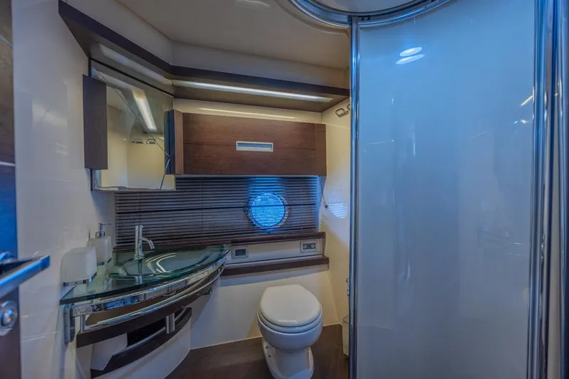  Yacht Photos Pics Luxurious bathroom in 2009 Azimut 68S yacht with modern fixtures and elegant design.