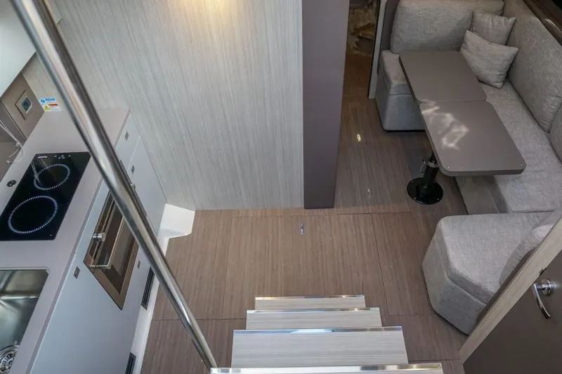  Yacht Photos Pics Interior of 2022 Cranchi M44HT yacht with modern kitchen and cozy seating area.