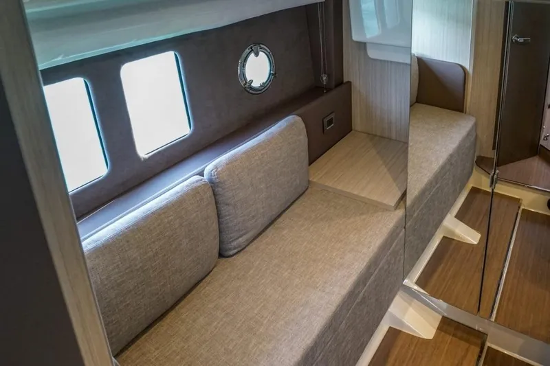  Yacht Photos Pics Interior of 2022 Cranchi M44HT yacht with modern seating and wood accents.