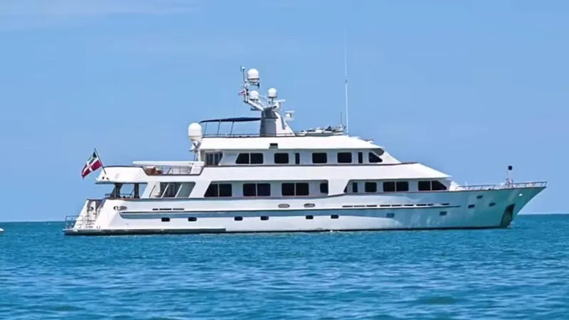 Ligaya Yacht Photos Pics Custom Ocean Pacifico Diana yacht, 2002 model, sailing on clear blue waters.