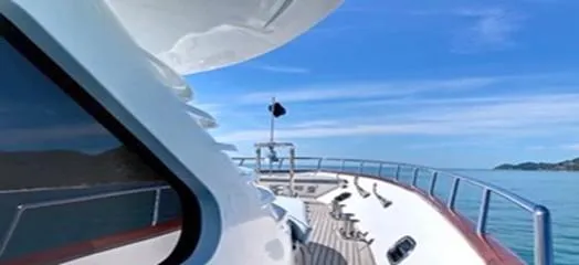 Ligaya Yacht Photos Pics Luxury yacht Ocean Pacifico Diana 2002 cruising on a clear blue sea.