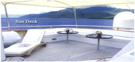 Ligaya Yacht Photos Pics Sun deck of 2002 Custom Ocean Pacifico Diana yacht with lounge chairs and ocean view.