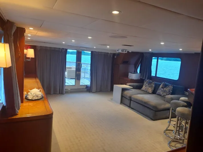 Ligaya Yacht Photos Pics Luxurious yacht interior with cozy seating, ocean view, and elegant lighting. Custom Ocean Pacifico Diana 2002.