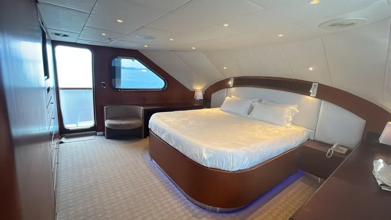 Ligaya Yacht Photos Pics Luxurious bedroom on 2002 Custom Ocean Pacifico Diana yacht with ocean view and elegant decor.