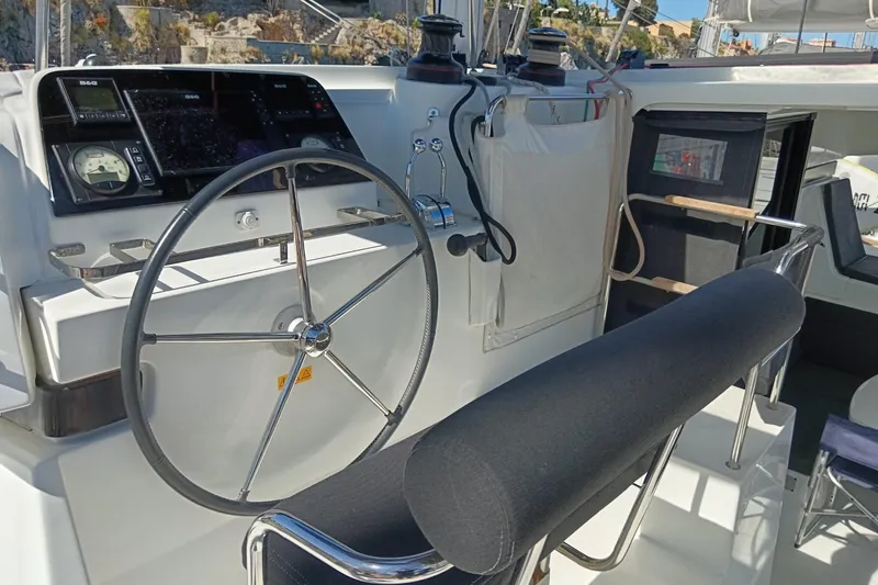  Yacht Photos Pics Steering wheel and controls of a 2019 Lagoon 42 catamaran yacht.