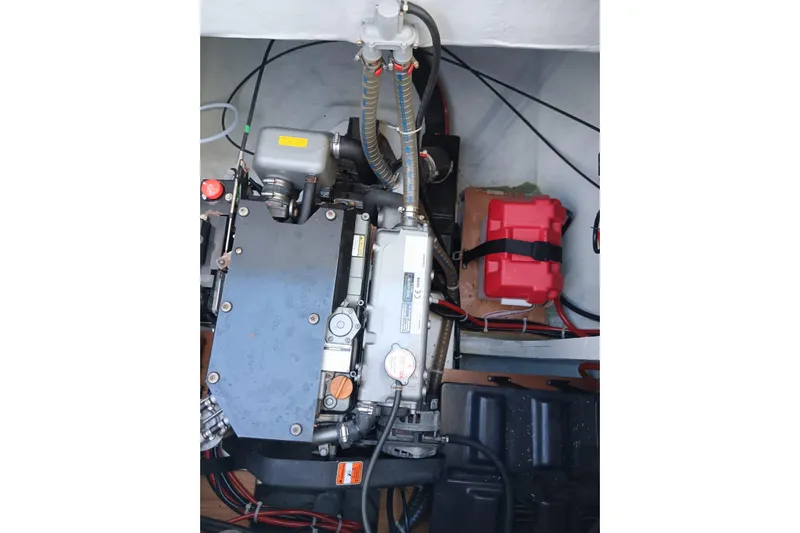  Yacht Photos Pics Engine compartment of a 2019 Lagoon 42 catamaran, featuring mechanical components and wiring.