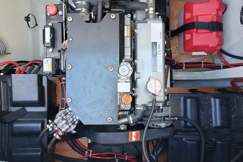  Yacht Photos Pics Engine compartment of a 2019 Lagoon 42 catamaran, featuring various mechanical components and wiring.