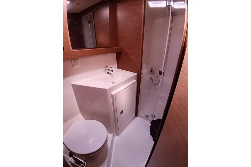 Yacht Photos Pics Modern bathroom in a 2019 Lagoon 42 yacht with shower and sink.