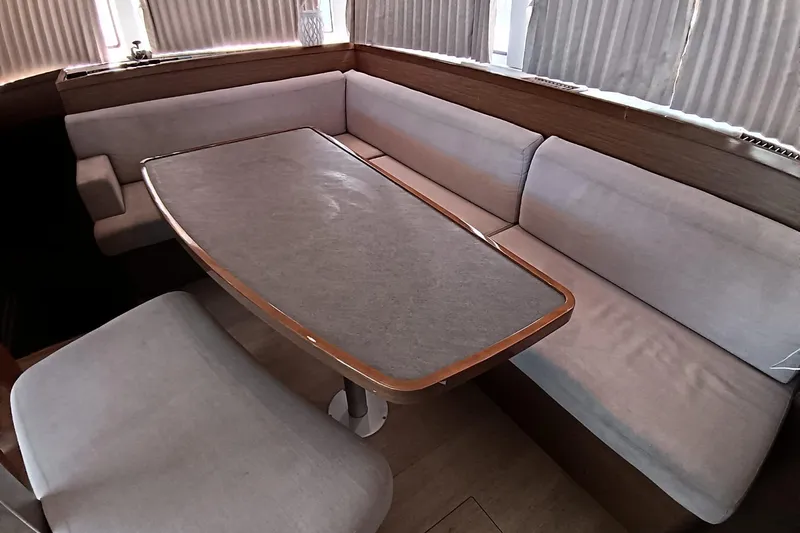  Yacht Photos Pics Interior of 2019 Lagoon 42 yacht with cozy seating and dining table.