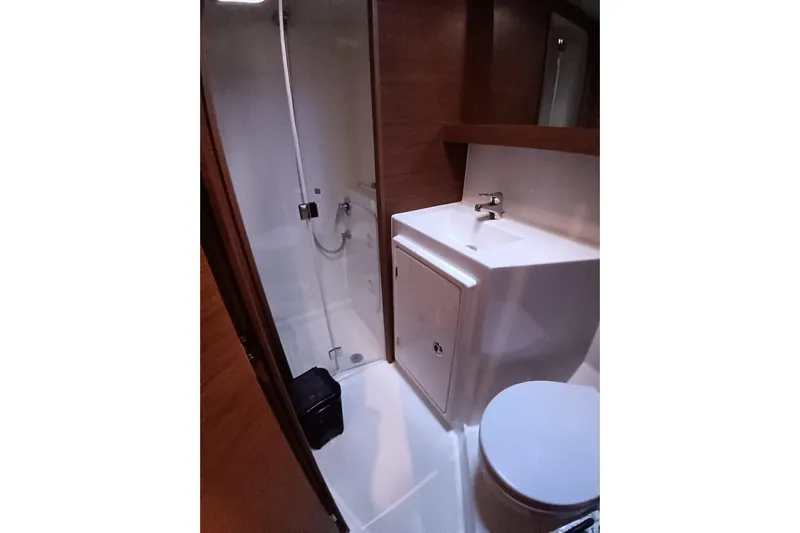  Yacht Photos Pics Bathroom interior of 2019 Lagoon 42 yacht with shower, sink, and toilet.