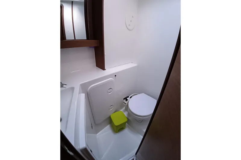  Yacht Photos Pics Compact bathroom in 2019 Lagoon 42 yacht with modern fixtures and white interior.