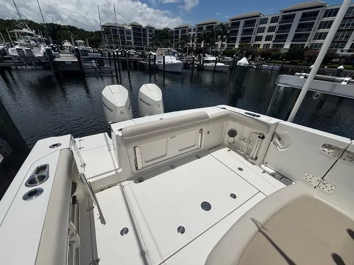  Yacht Photos Pics 2019 Boston Whaler 330 Outrage boat docked at marina with twin Mercury engines.