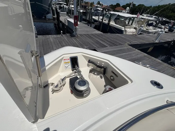  Yacht Photos Pics 2019 Boston Whaler 330 Outrage anchor compartment at marina dock.