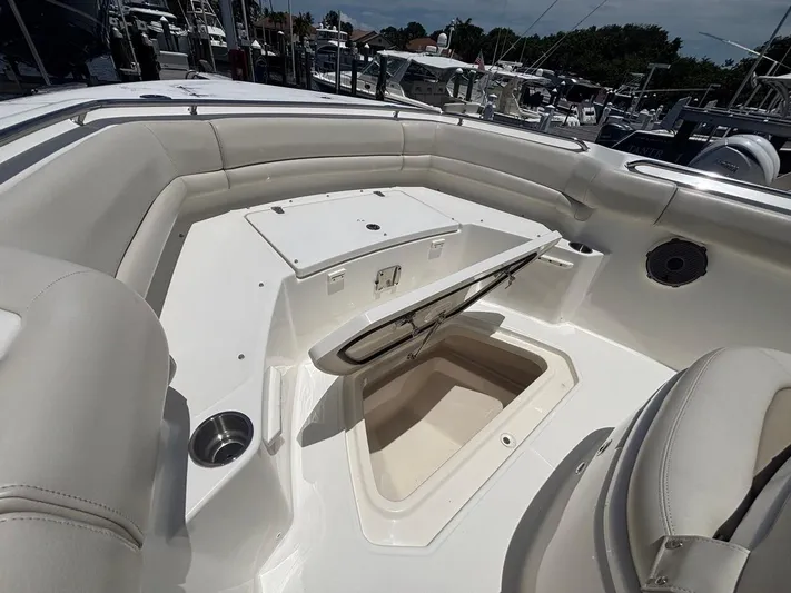  Yacht Photos Pics 2019 Boston Whaler 330 Outrage boat interior with open storage compartment.
