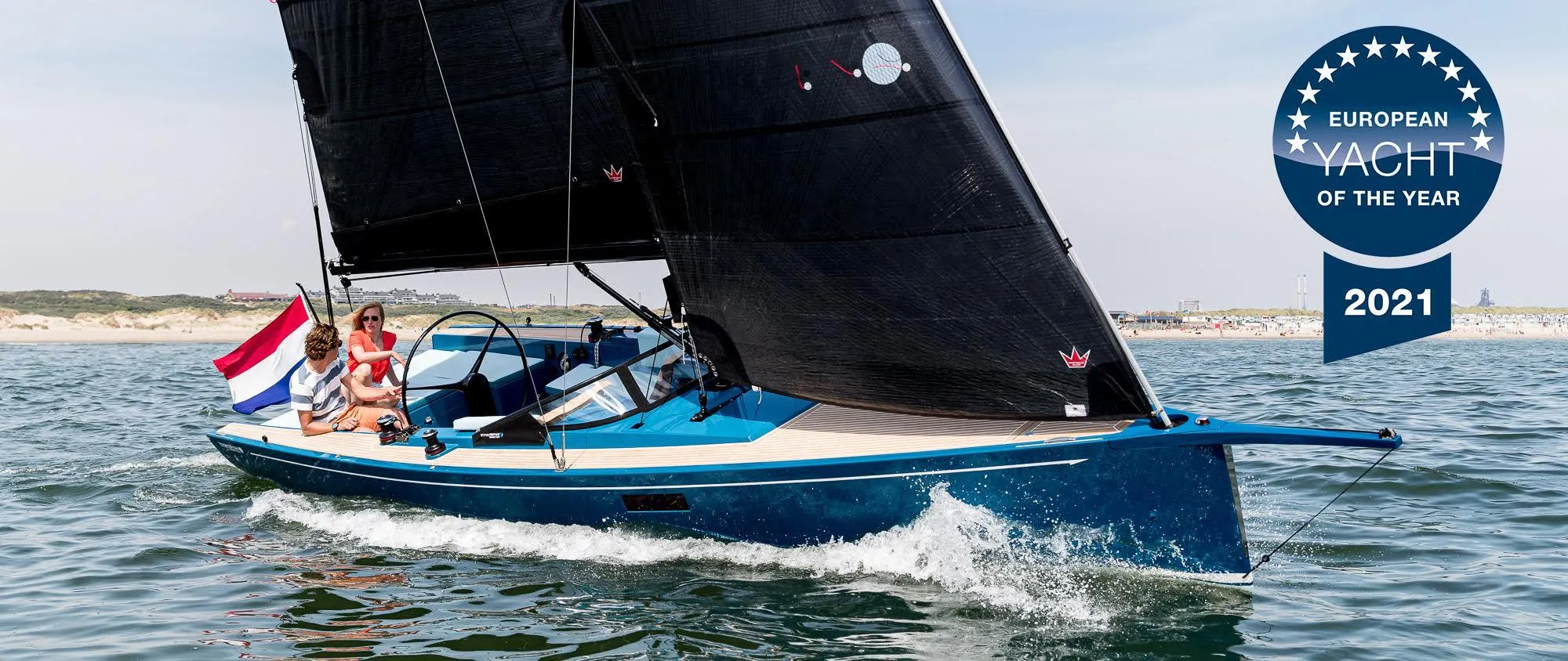 Saffier Se 27 Leisure yacht sailing, awarded European Yacht of the Year 2021, with Dutch flag.