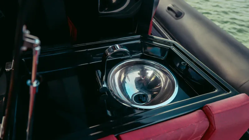 2023 Skipper-bsk 42 Quad 450r Yacht Photos Pics Stainless steel sink on Skipper-BSK 42 boat, 2023 model, with red leather accents.