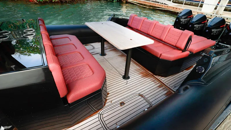 2023 Skipper-bsk 42 Quad 450r Yacht Photos Pics Luxurious Skipper-BSK 42 boat interior with red seating and sleek design, 2023 model.