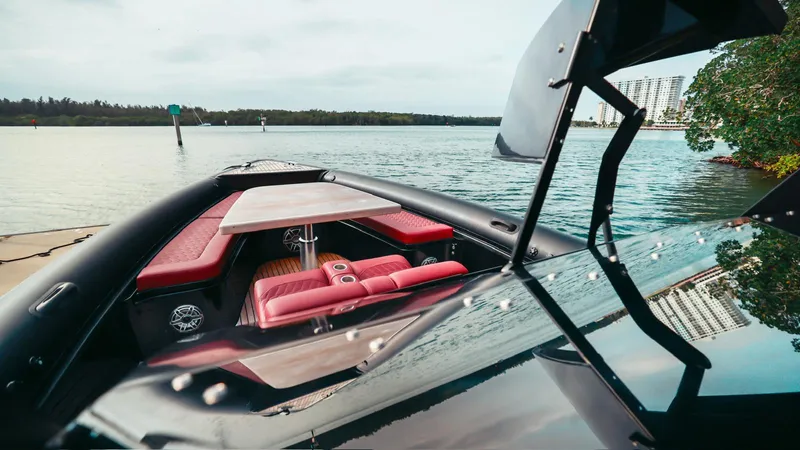 2023 Skipper-bsk 42 Quad 450r Yacht Photos Pics 2023 Skipper-BSK 42 boat with red seating and table on calm water.