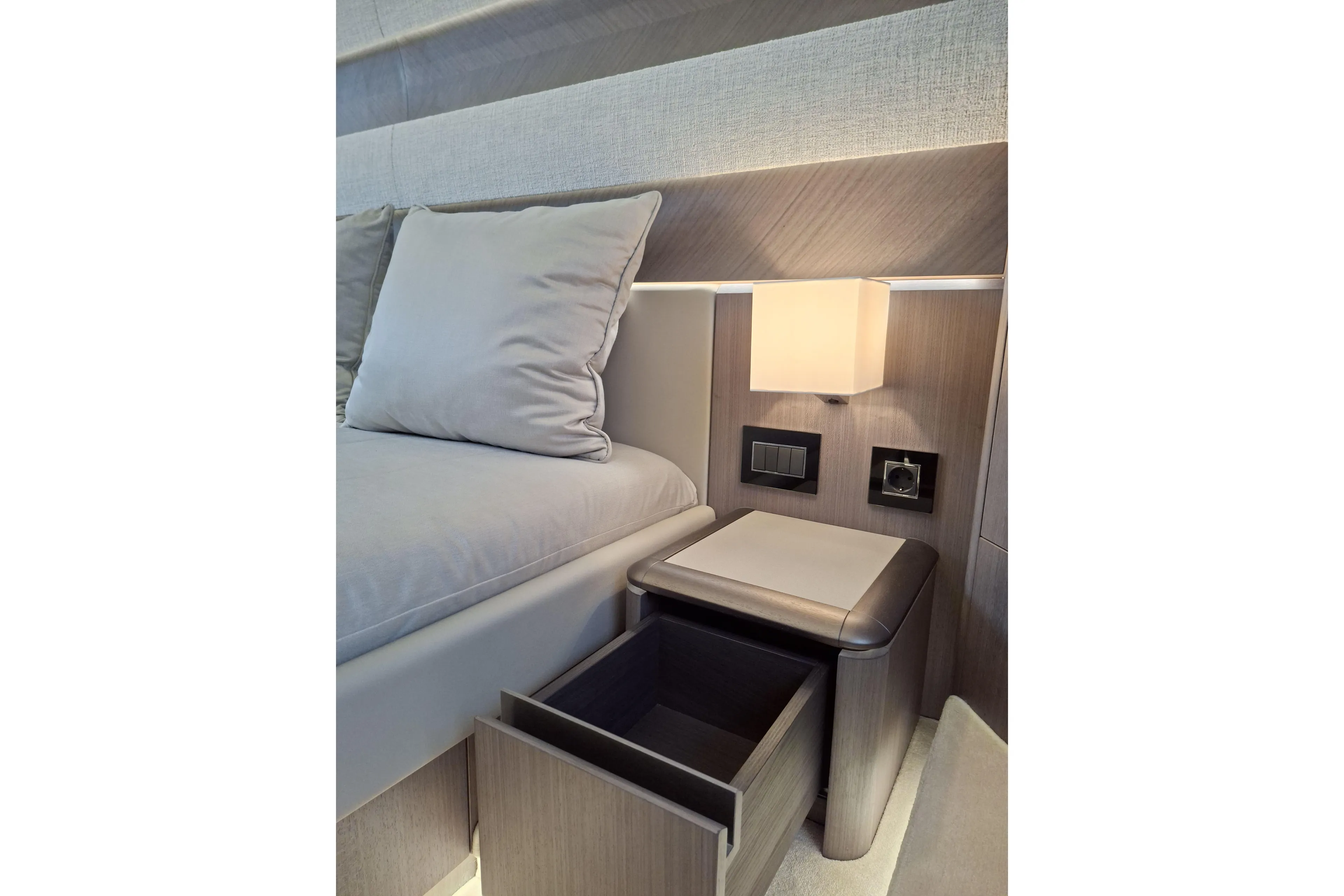  Yacht Photos Pics Luxurious interior of 2026 Galeon 560 Fly yacht with modern bedside drawer and lighting.
