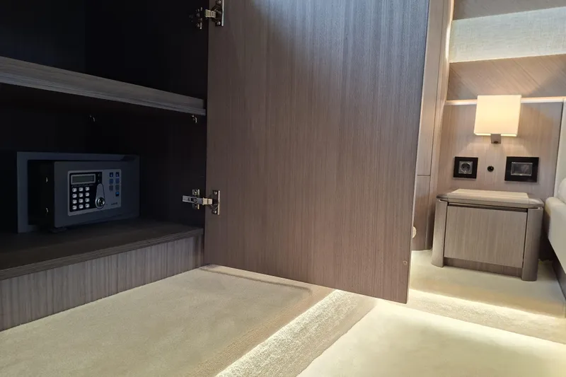  Yacht Photos Pics Interior of 2026 Galeon 560 Fly yacht featuring a safe and elegant wood cabinetry.