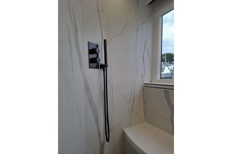  Yacht Photos Pics Modern bathroom with sleek shower fixtures in 2026 Galeon 560 Fly yacht.