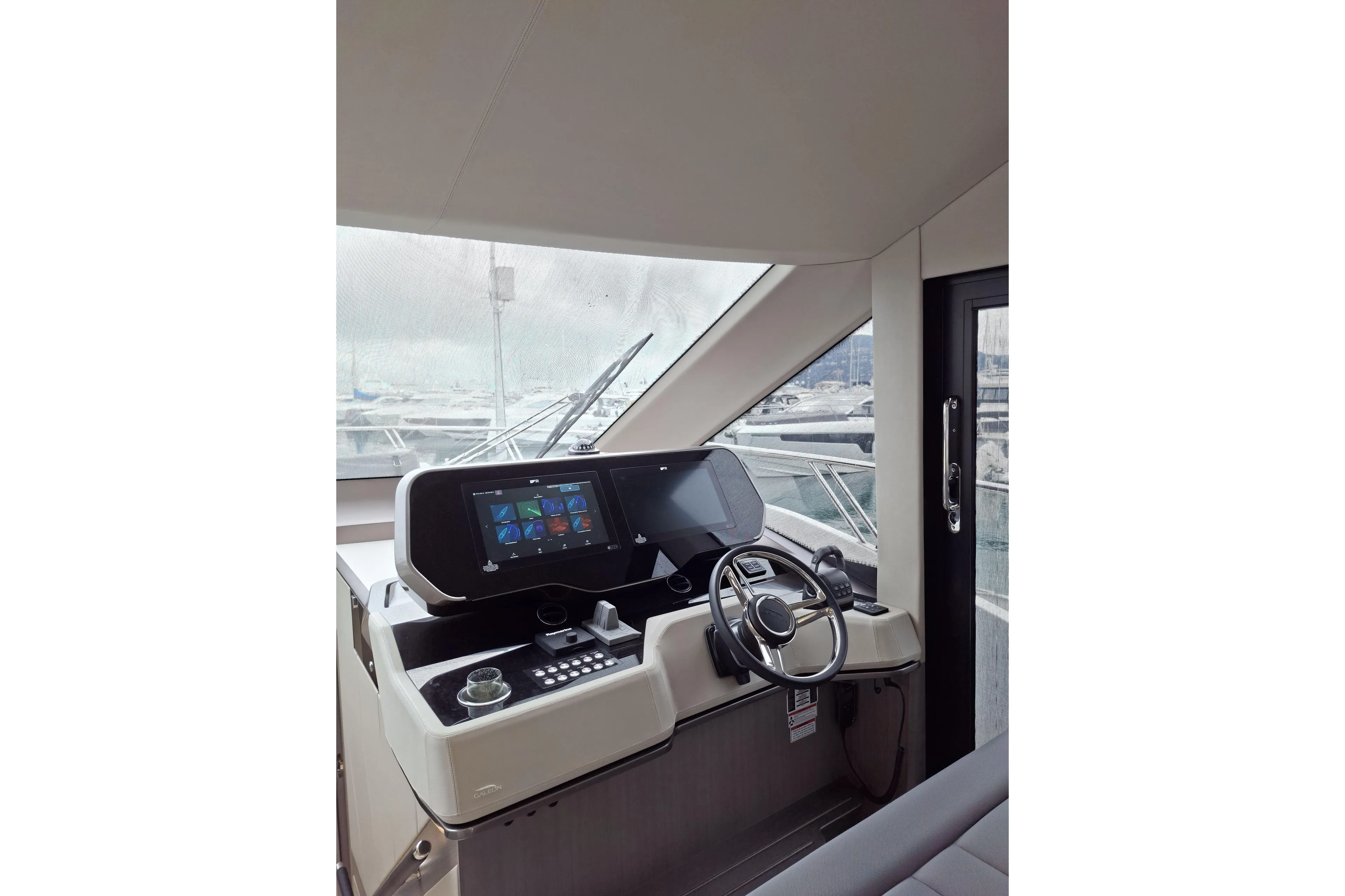  Yacht Photos Pics Interior helm of 2026 Galeon 560 Fly yacht with modern navigation controls.