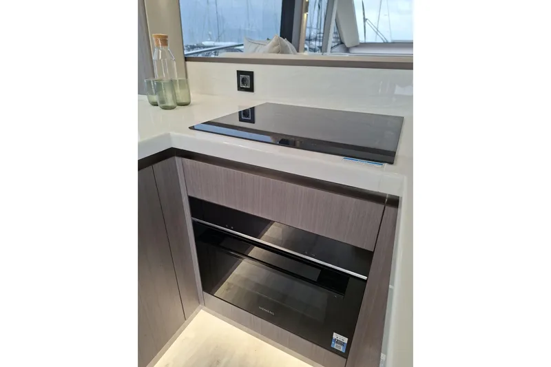  Yacht Photos Pics Modern kitchen area in 2026 Galeon 560 Fly yacht with sleek appliances.