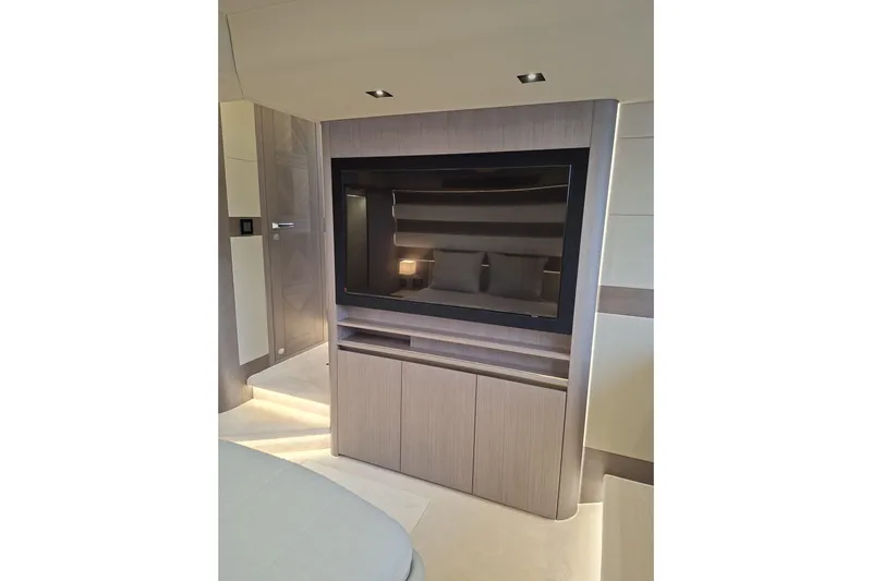  Yacht Photos Pics Luxurious interior of 2026 Galeon 560 Fly yacht with modern TV setup.