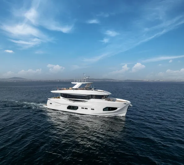 Numarine 22xp Hull #7 Yacht Photos Pics 2025 Numarine 22xp yacht cruising on open sea under clear blue sky.