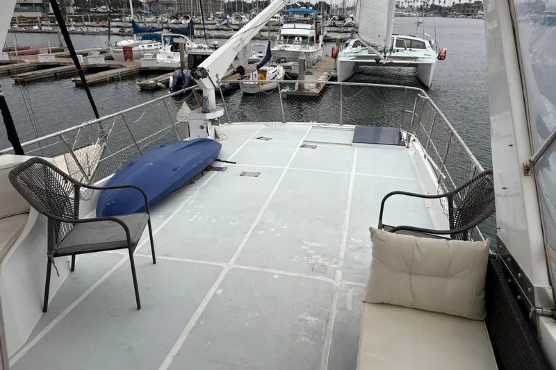Majestic Z Yacht Photos Pics Spacious deck of 1990 Angel Pilothouse yacht with seating and marina view.