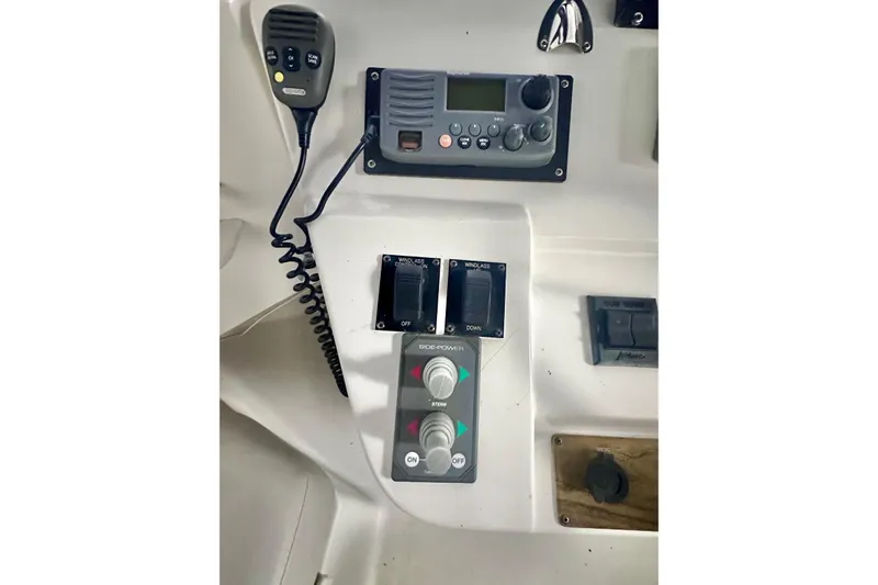 Ohana Yacht Photos Pics Control panel of a 1999 Mainship 390 Trawler with radio and switches.