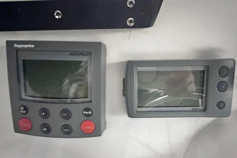 Ohana Yacht Photos Pics Raymarine autopilot and depth display on 1999 Mainship 390 Trawler dashboard.