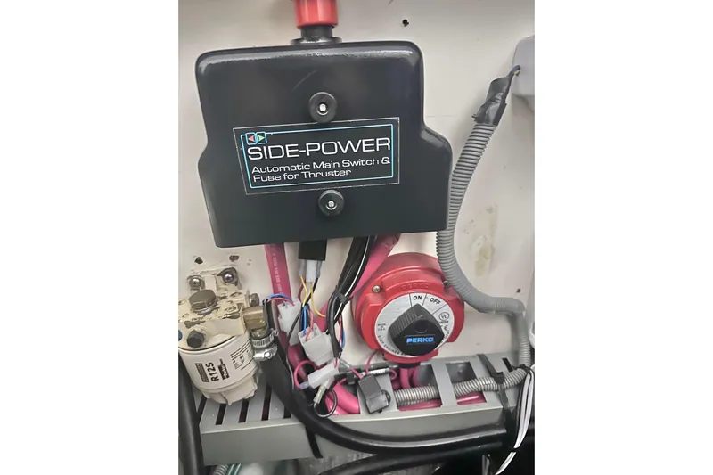 Ohana Yacht Photos Pics Electrical components of a 1999 Mainship 390 Trawler, featuring Side-Power switch and Perko dial.